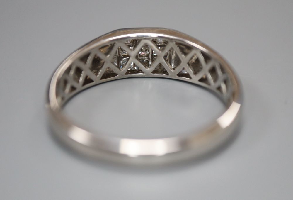 A modern Pravins 18ct white gold and channel set nine stone princess cut diamond square cluster ring, size Z++++, gross 7.9 grams.